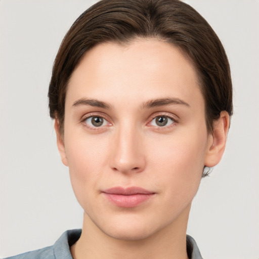 Neutral white young-adult female with short  brown hair and brown eyes