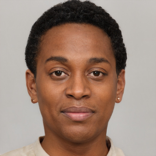 Joyful black young-adult female with short  black hair and brown eyes
