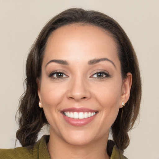 Joyful white young-adult female with medium  brown hair and brown eyes