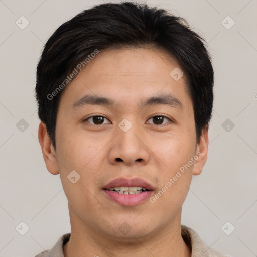 Joyful asian young-adult male with short  brown hair and brown eyes