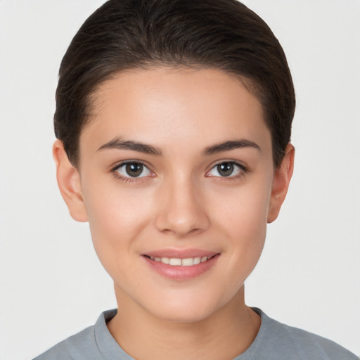 Joyful white young-adult female with short  brown hair and brown eyes