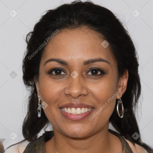 Joyful black young-adult female with long  brown hair and brown eyes