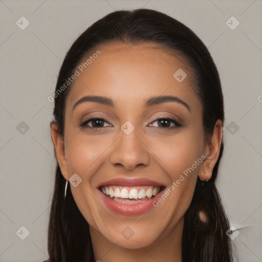 Joyful latino young-adult female with long  black hair and brown eyes