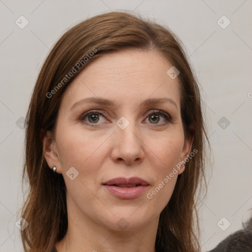 Joyful white adult female with medium  brown hair and grey eyes