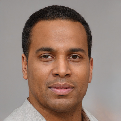 Neutral latino young-adult male with short  brown hair and brown eyes
