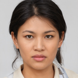 Neutral asian young-adult female with medium  brown hair and brown eyes