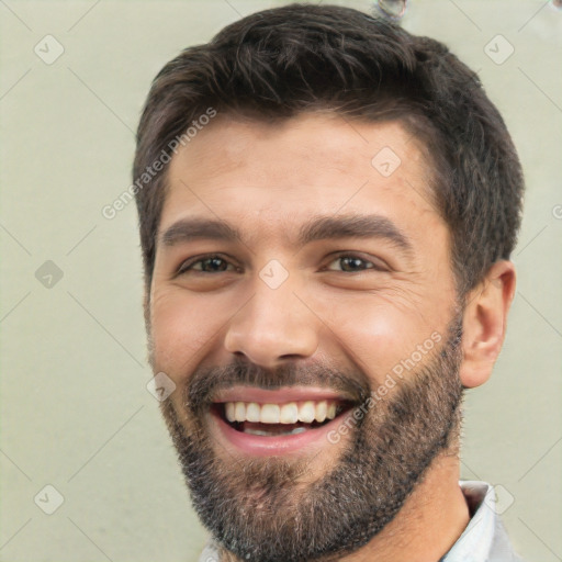 Joyful white young-adult male with short  black hair and brown eyes