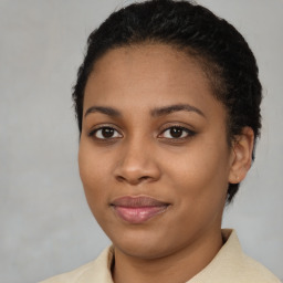 Joyful latino young-adult female with medium  black hair and brown eyes