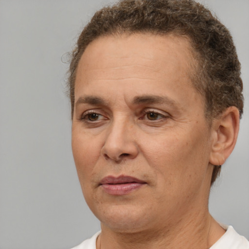 Joyful white adult female with short  brown hair and brown eyes