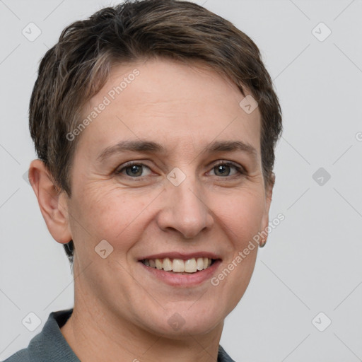 Joyful white adult female with short  brown hair and grey eyes