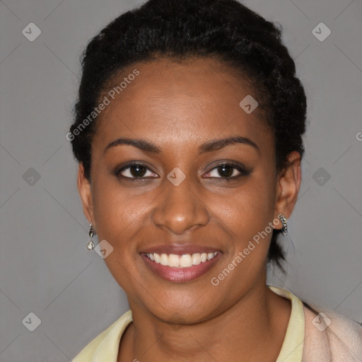 Joyful black young-adult female with short  black hair and brown eyes