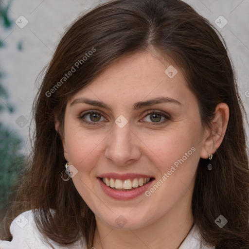 Joyful white young-adult female with long  brown hair and grey eyes