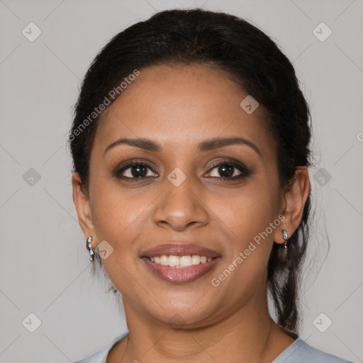 Joyful latino young-adult female with medium  brown hair and brown eyes