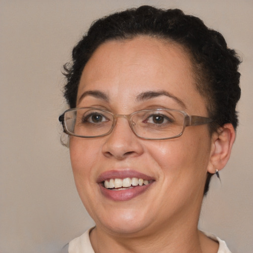 Joyful latino adult female with short  brown hair and brown eyes