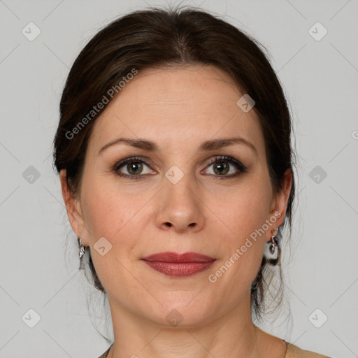 Joyful white adult female with medium  brown hair and grey eyes