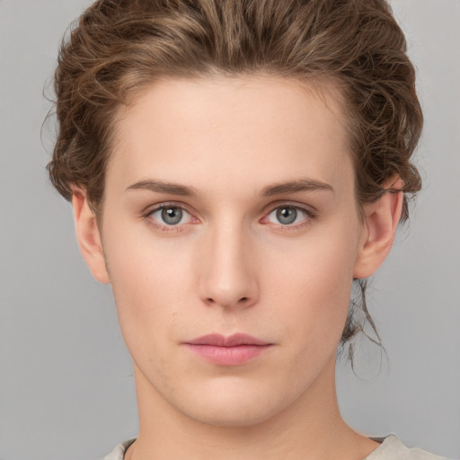 Neutral white young-adult female with short  brown hair and green eyes