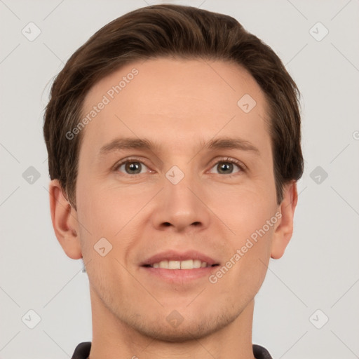 Joyful white young-adult male with short  brown hair and grey eyes