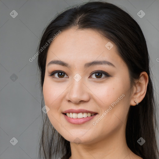 Joyful white young-adult female with long  brown hair and brown eyes