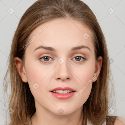 Joyful white young-adult female with long  brown hair and grey eyes