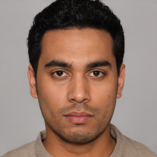 Neutral latino young-adult male with short  black hair and brown eyes