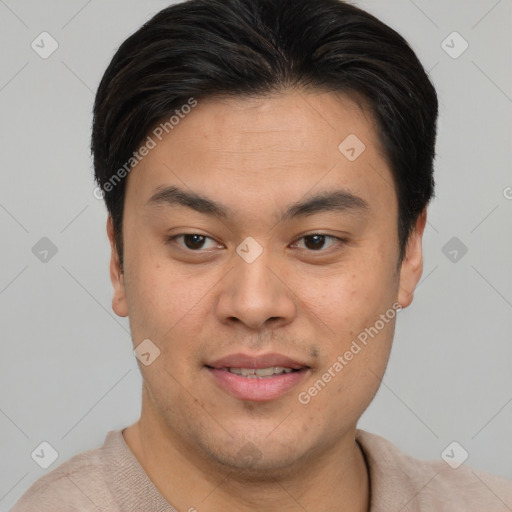 Joyful asian young-adult male with short  brown hair and brown eyes