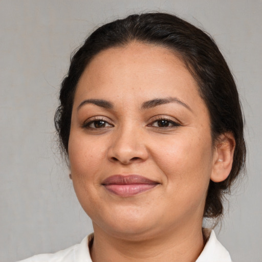 Joyful white adult female with medium  brown hair and brown eyes