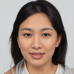 Joyful asian young-adult female with medium  brown hair and brown eyes