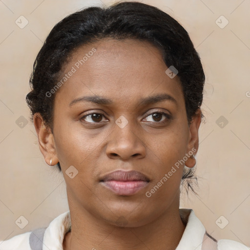 Joyful black young-adult female with short  brown hair and brown eyes