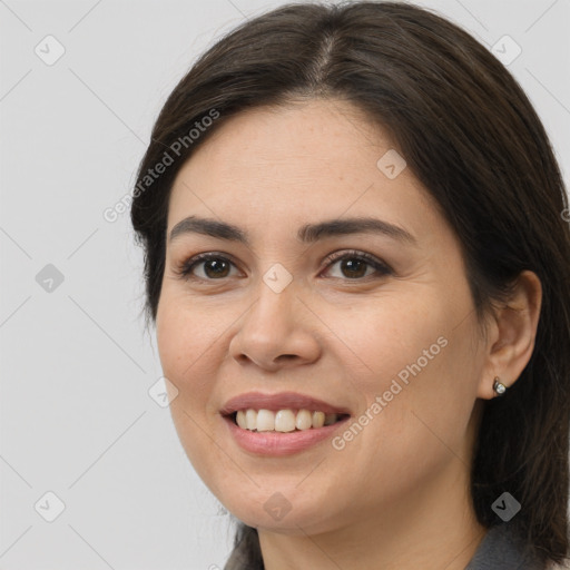 Joyful white young-adult female with medium  brown hair and brown eyes