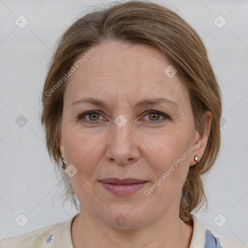 Joyful white adult female with medium  brown hair and grey eyes