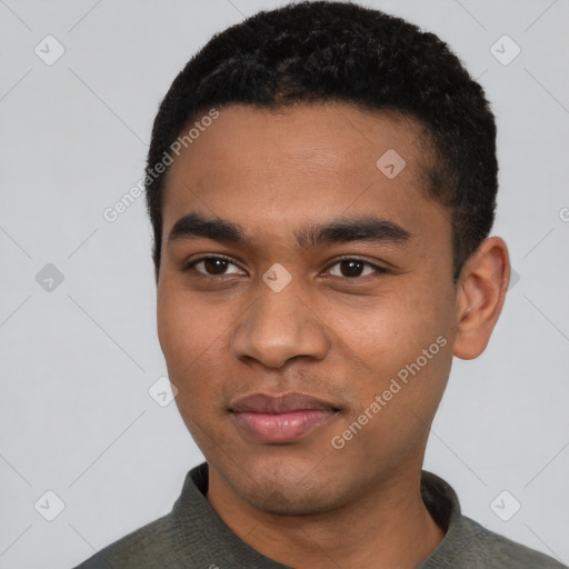 Joyful black young-adult male with short  black hair and brown eyes