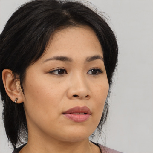 Neutral asian young-adult female with medium  brown hair and brown eyes