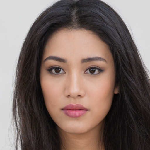 Neutral asian young-adult female with long  brown hair and brown eyes