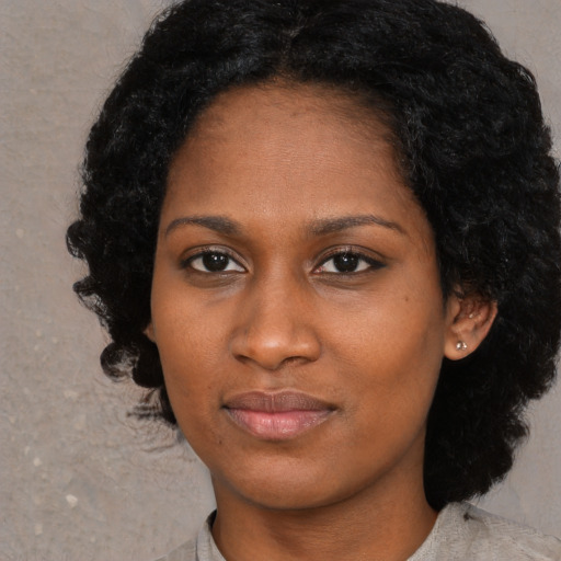 Neutral black young-adult female with medium  black hair and brown eyes