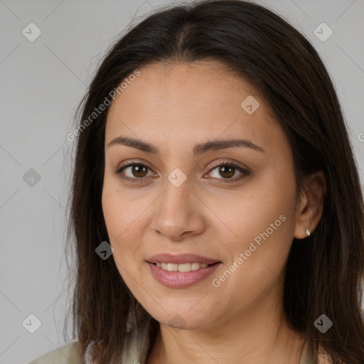 Joyful white young-adult female with long  brown hair and brown eyes