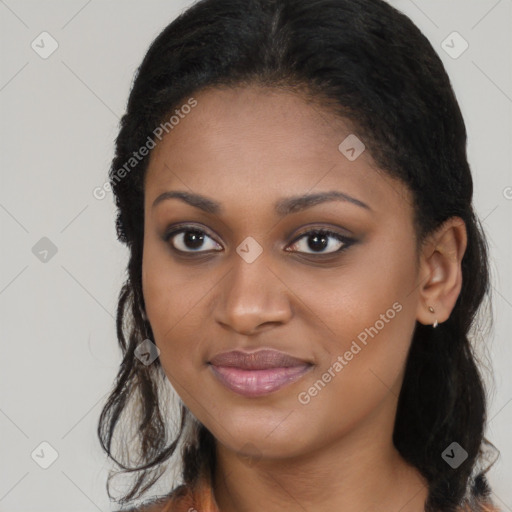 Joyful black young-adult female with long  brown hair and brown eyes