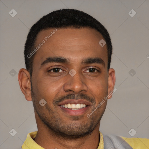 Joyful black young-adult male with short  brown hair and brown eyes