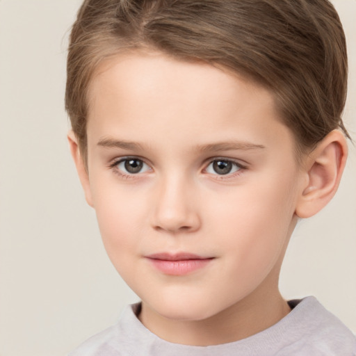 Joyful white child female with short  brown hair and brown eyes