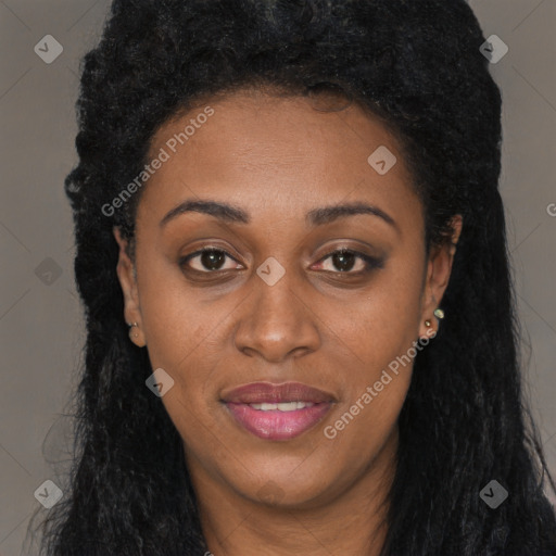 Joyful black young-adult female with long  black hair and brown eyes