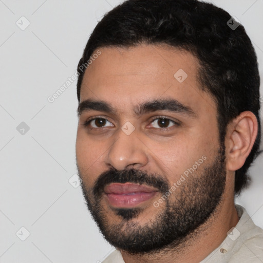 Joyful latino young-adult male with short  black hair and brown eyes