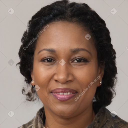 Joyful black adult female with medium  brown hair and brown eyes