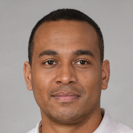 Neutral latino young-adult male with short  brown hair and brown eyes