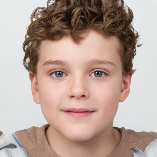 Joyful white child male with short  brown hair and grey eyes