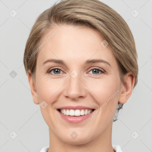 Joyful white young-adult female with short  brown hair and grey eyes