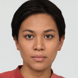 Neutral white young-adult female with short  brown hair and brown eyes