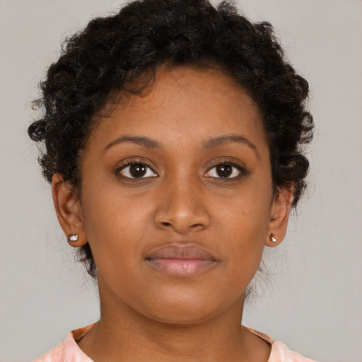 Neutral black young-adult female with short  brown hair and brown eyes