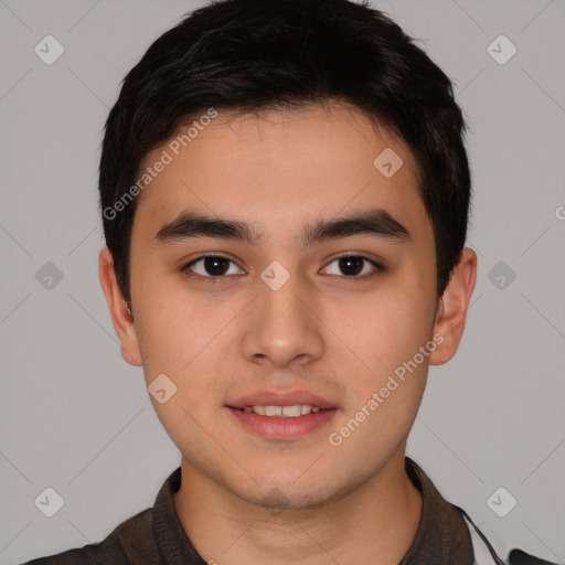 Joyful asian young-adult male with short  brown hair and brown eyes