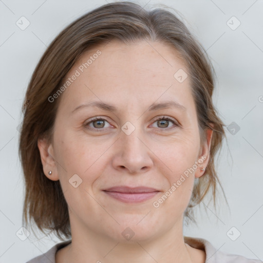 Joyful white adult female with medium  brown hair and grey eyes