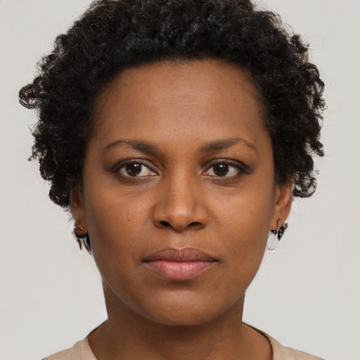 Neutral black young-adult female with short  brown hair and brown eyes