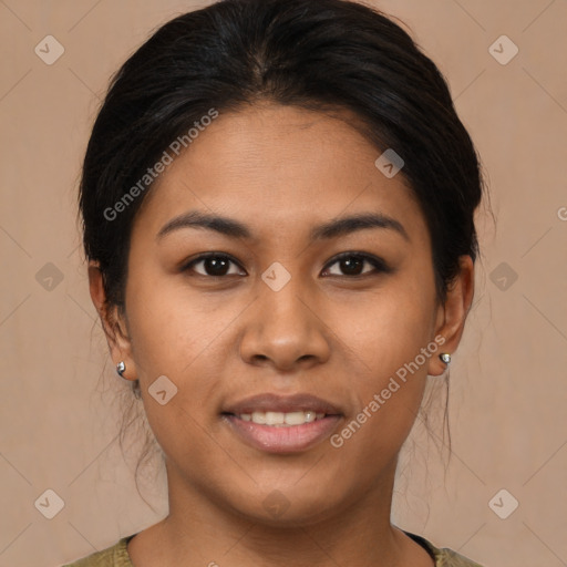 Joyful latino young-adult female with medium  brown hair and brown eyes